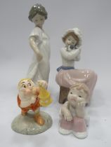3 Nao figurines and a Snow white dwarf figurine.