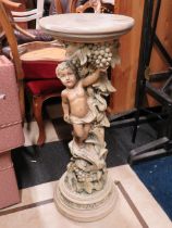Marble and faux Marble Jardinaire stand carved with Grapes and a cherub. H:34 inches and 12 inches