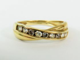 14ct Yellow Gold CZ set crossover ring. Finger size 'Q-5 to R' 2.7