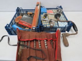 Various tools, drill bits and a selection of screws.