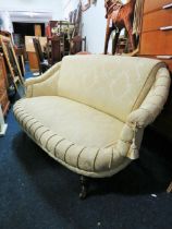Nicely upholstered Early 20th Century boudoir style two seater settee with Ivory fabric and tassles.