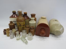 Selection of stoneware bottles & pots, bed warmers and small glass bottles.