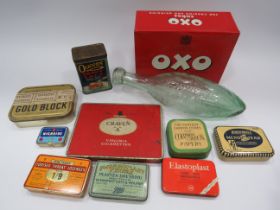 Selection of vintage tins and a vintage glass water bottle.