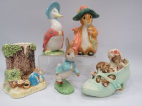 Beatrix Potter lot including a Beswick Peter Rabbit figurine and 3 money boxes, some have boxes.
