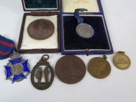 7 Rifle club tokens/ medals , one is sterling silver.