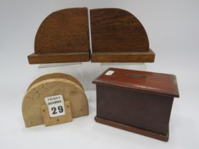 Vintage wooden money box, pair of bookends and a letter rack.