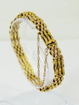 15ct Yellow Gold three bar bracelet with safety chain fitted. Total weight