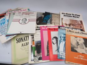 Selection of various vintage sheet music.