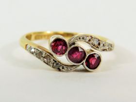 18ct Yellow Gold Ring set with Three Rubies with Diamond set waves to top and bottom. Finger size