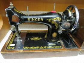 Vintage Singer Sewing Machine, Model 128K with wooden cover, appears to be in working order . See