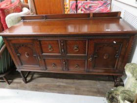 Early 20th Century Oak Dresser with carved decoration to front. Two cupboard doors.. H:36 x W:59 x D