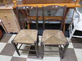 Pair of Edwardian era parlour chairs with raffia seat squabs. See photos.
