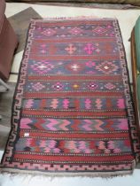 Eastern style fringed rug which measures approx 64 x 41 inches. In good order . See photos. S2