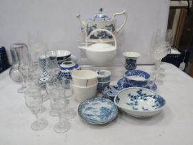 Selection of blue and white ceramics and wine glasses.
