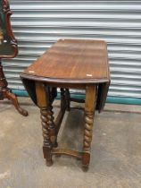 Oval topped Drop leaf gate legged Oak Table with barley twist legs. In very good condition and good