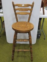Oak made bar stool with integrated back rest. Seat Height 27 inches. Back height 39 inches. See pho