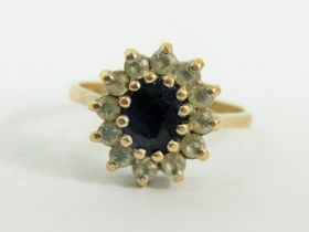 9ct Yellow Gold ring set in a Flower pattern. Finger size 'N-5' 2.8g