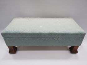 Long footstool with lifting needlepoint top.