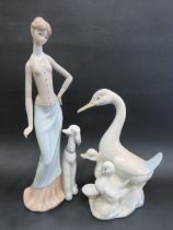 Two Spanish Pottery Figurines, Lady with Poodle (no umbrella) plus Mother Duck with two Ducklings.