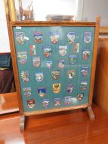 Oak Framed fire screen set with Swiss and German Ramblers cloth bages set under glass decoration. M