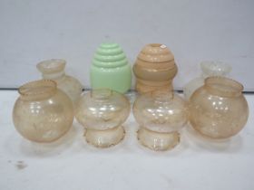 Selection of various vintage glass light shades.