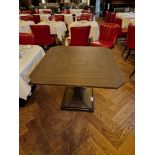 A bespoke Robert Angell Churchill dining table the oak top mounted above a shaped square pedestal