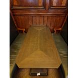 A bespoke Robert Angell Churchill rectangular dining table the oak top mounted above a shaped square