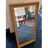 A wooden gilt framed bevelled edge mirror 75 x 40cm