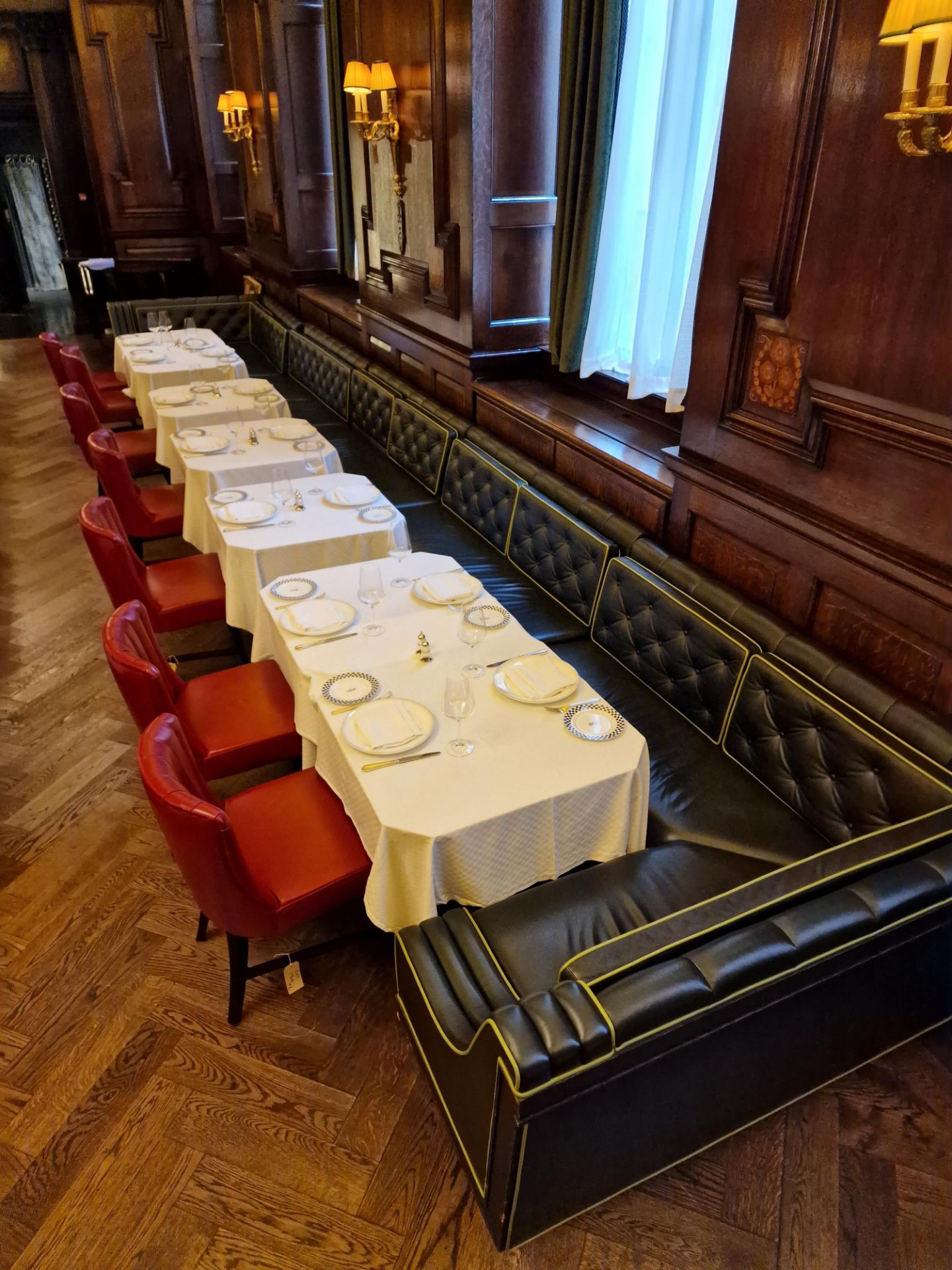 A bespoke Robert Angell tufted leather banquette U shaped upholstered in green full leather with