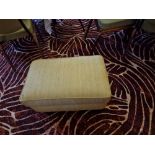 An upholstered sage fabric footstool with light timber legs 46 x 70 x 38cm