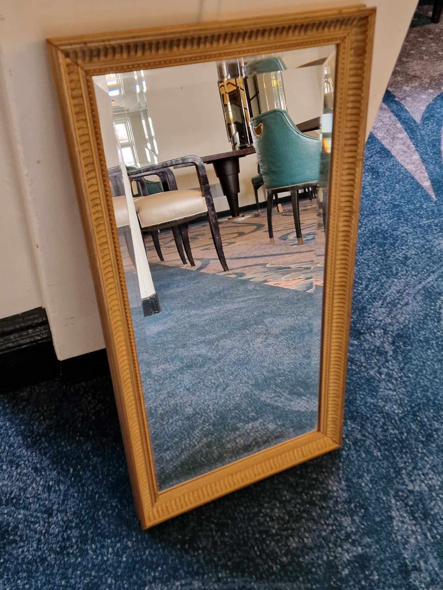 A wooden gilt framed bevelled edge mirror 75 x 40cm