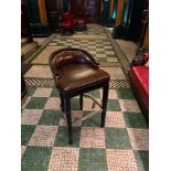 A Leather Club Bar Stool Upholstered in A Dark Tone Leather The Frame Stained Dark With A