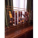 A decorative mirrored panel 18 oak framed gold tinted glass mirror panes mounted on a brass