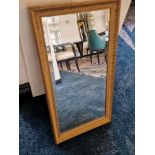 A wooden gilt framed bevelled edge mirror 75 x 40cm