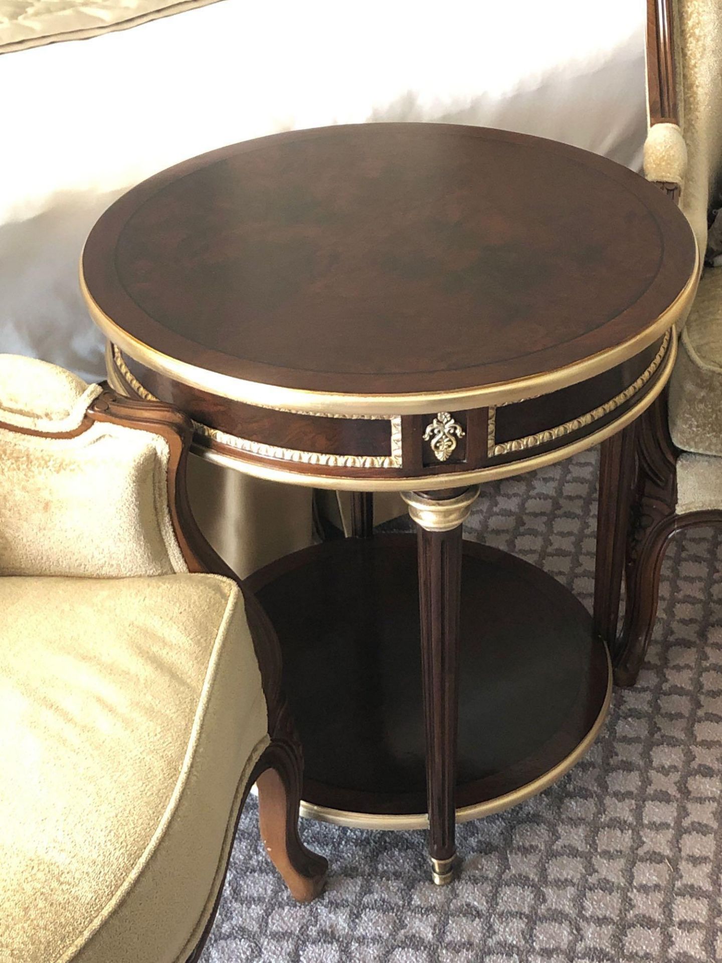 Circular Side Table With Antiqued Plate Top And Brass Trim Mounted On Tapering Legs With Brass