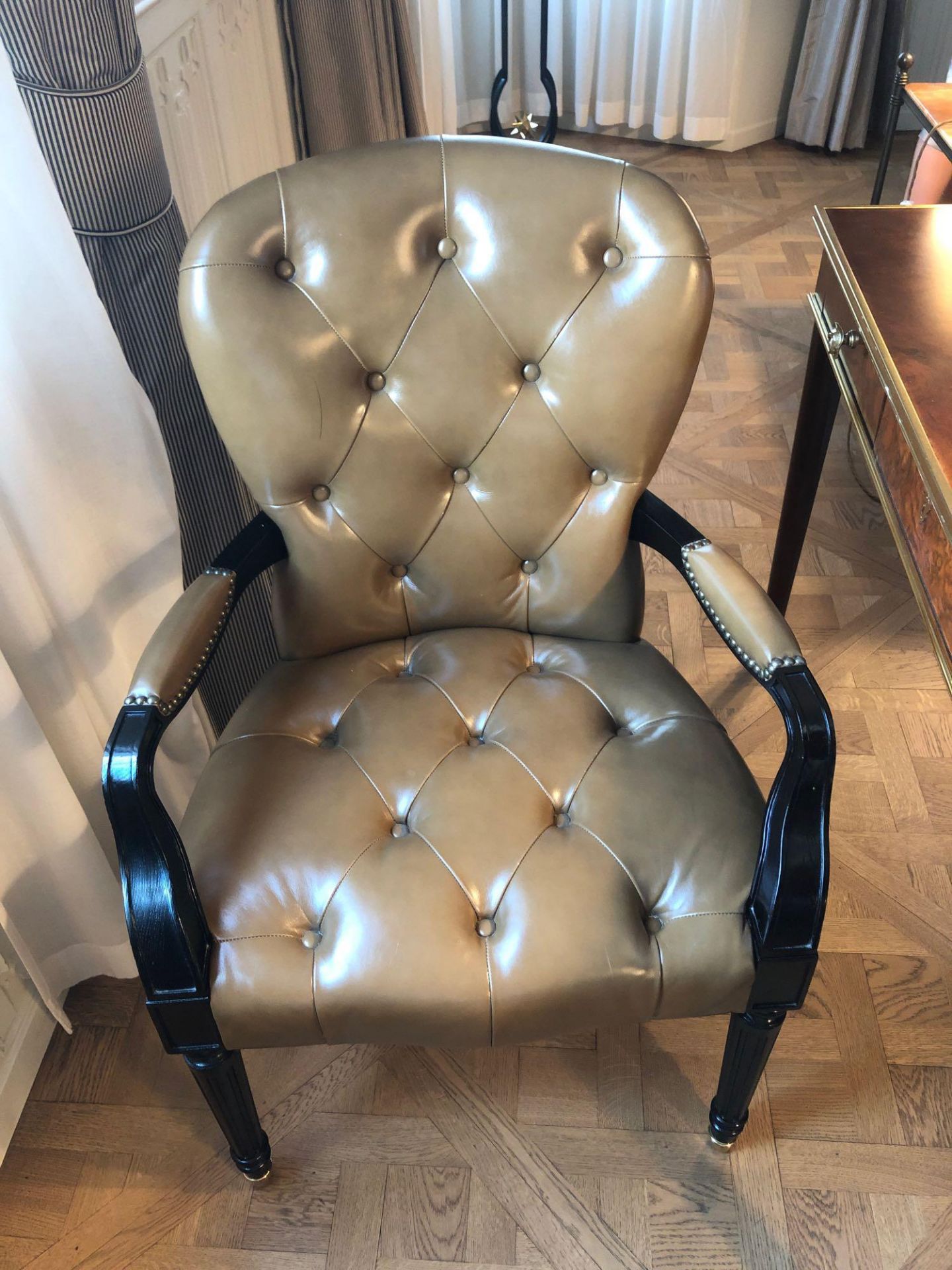 A Leather Tufted Armchair With Chesterfield Style Button And Stud Detail 60 x 63 x 95cm (Room 506/7)