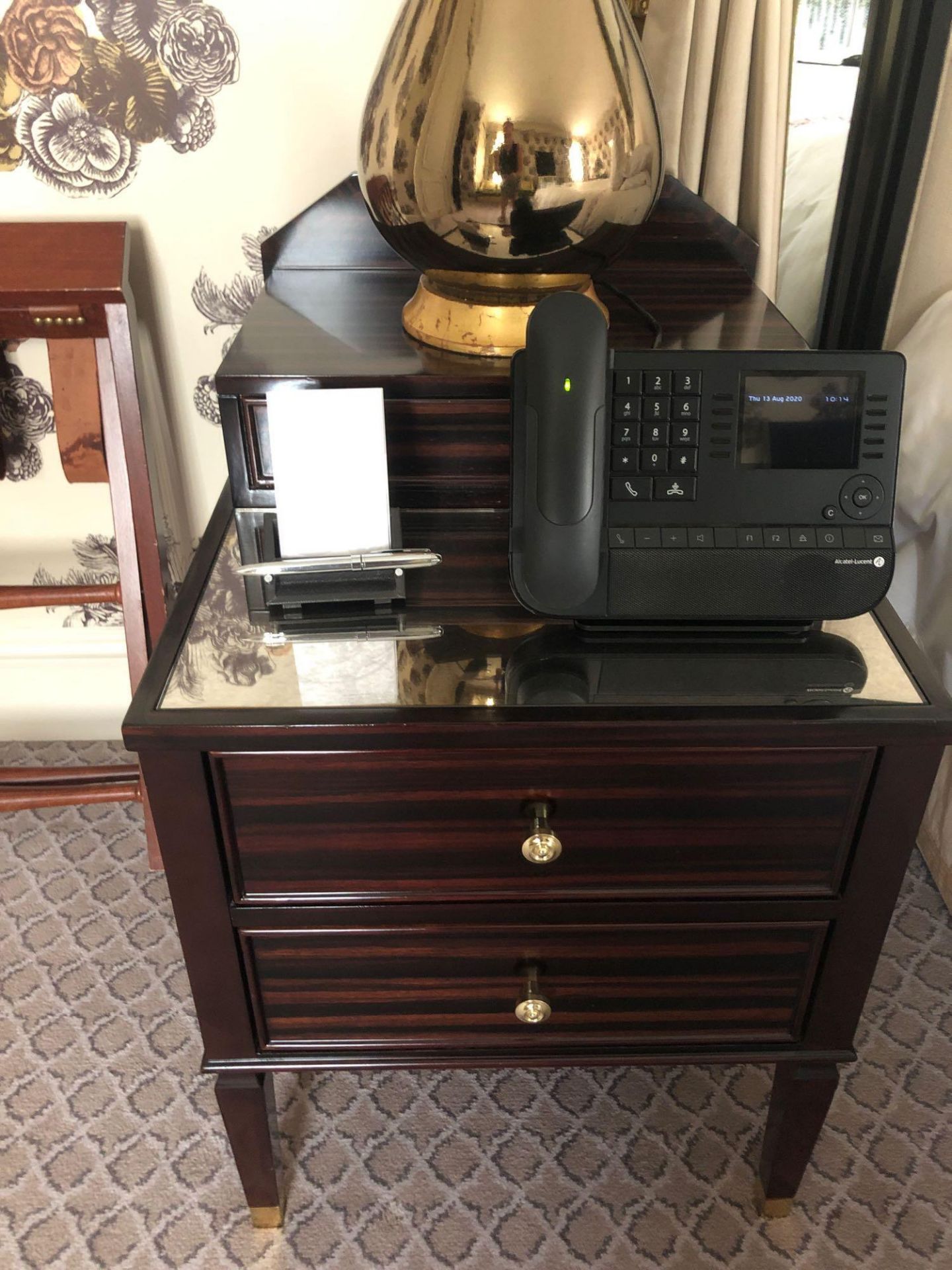 A Pair Of Two Tier Bedside Nightstands With Antiqued Plate Top With Storage Compartments Mounted