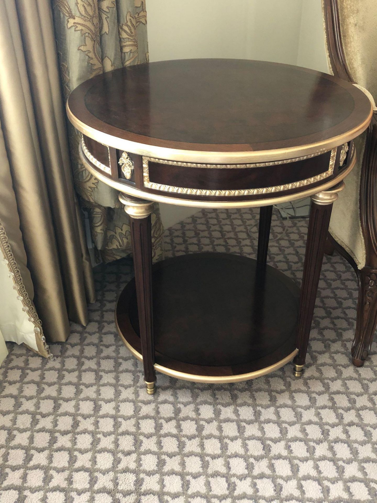 Circular Side Table With Antiqued Plate Top And Brass Trim Mounted On Tapering Legs With Brass