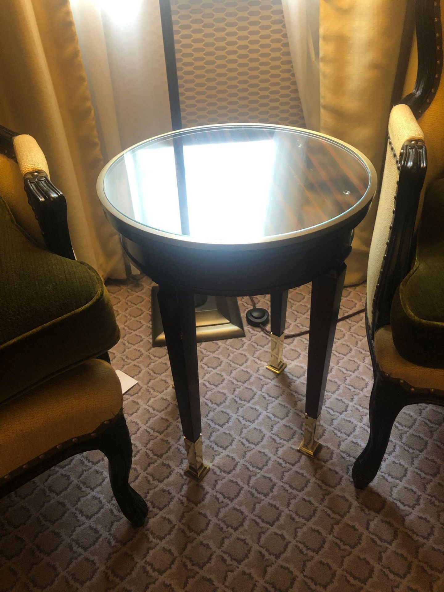 Circular Side Table With Antiqued Plate Top And Brass Trim Mounted On Tapering Legs With Brass