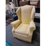 Wing Back Armchair Classic Styled Wing Arm Chair Framed And Upholstered In A Gold Yellow Cover