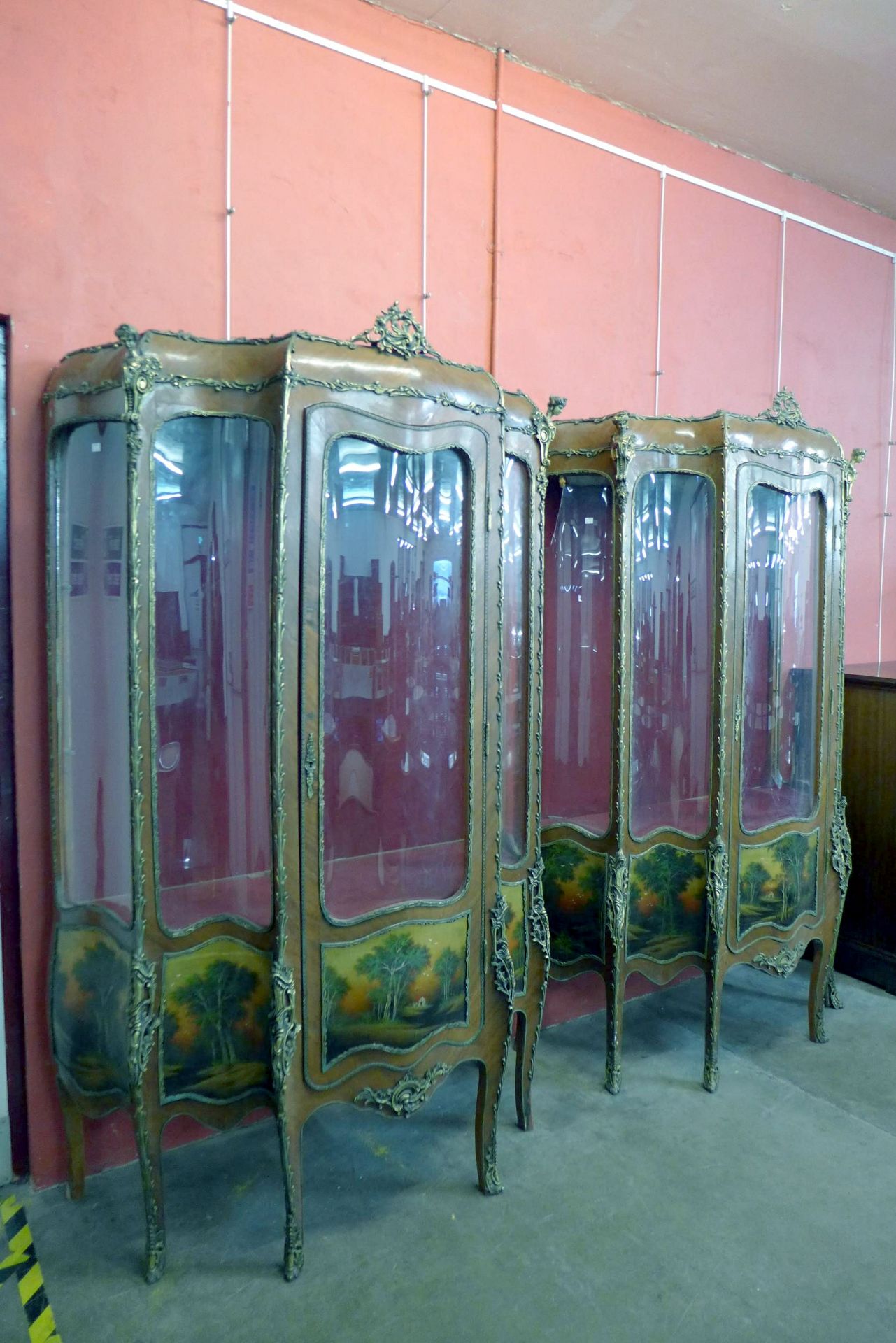 A French Vernis Martin vitrine, in the Louis XVI Style of serpentine form, with ormolu mounting