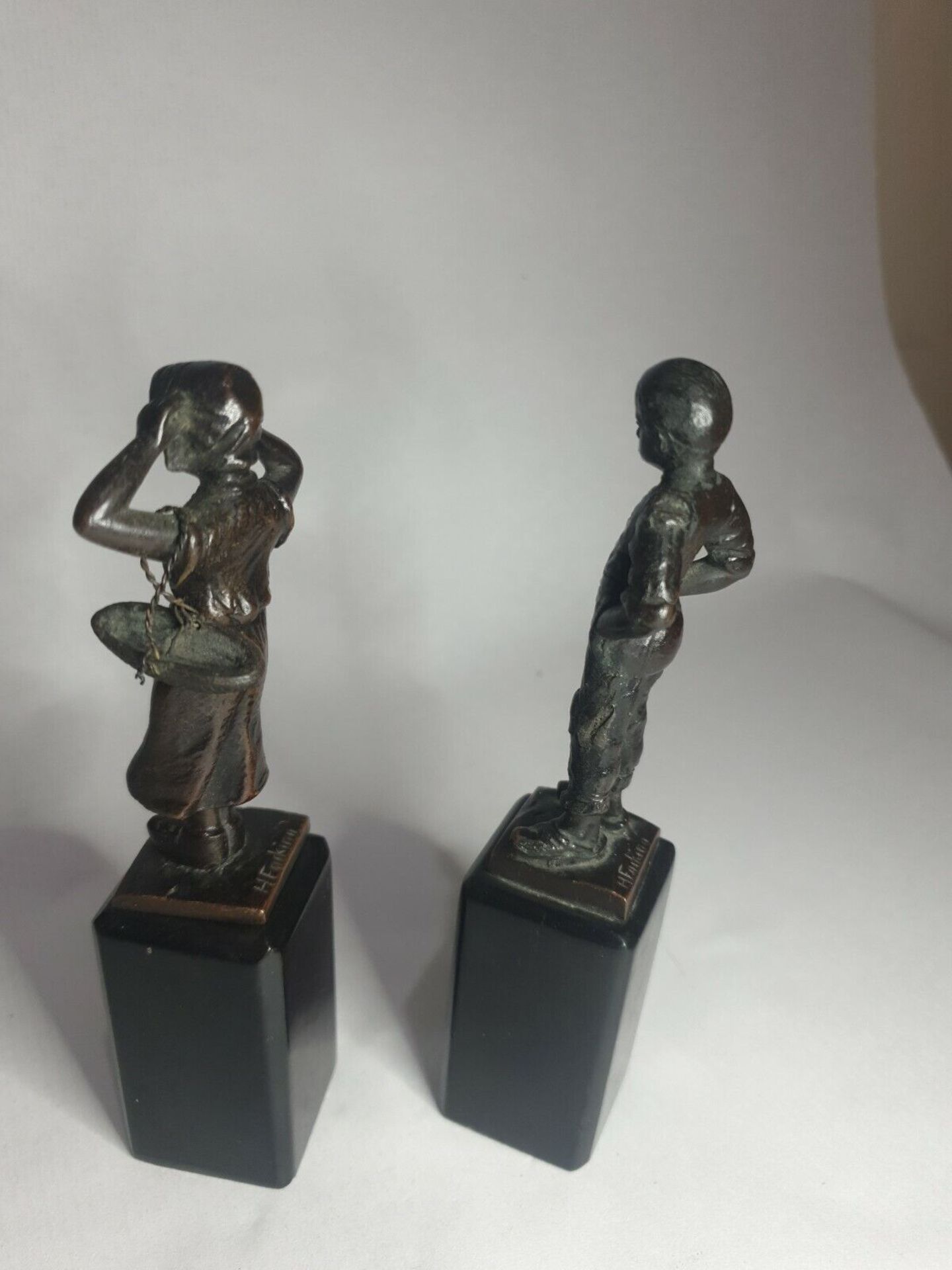 Two early 20th century bronze statuettes of a Dutch boy and girl, German signed to base H. - Image 3 of 5