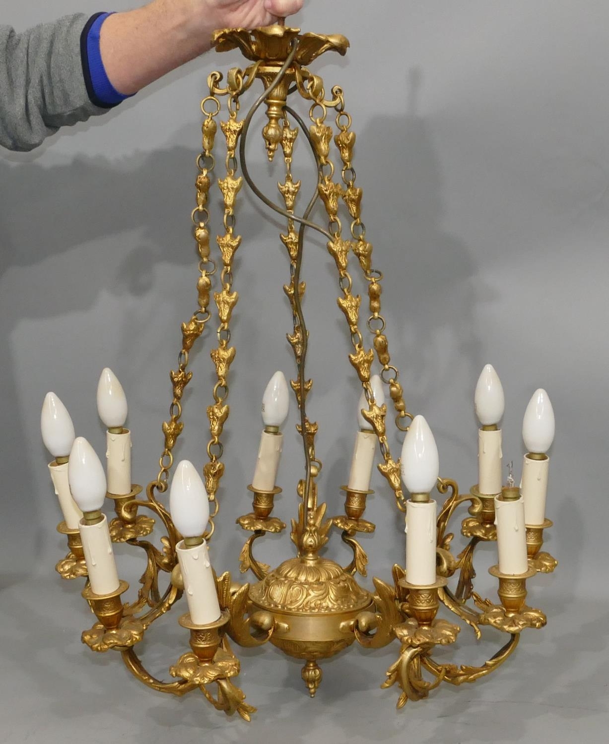 French Chandelier Highly Ornate Detail With Gold Gilt Over Bronze In The Louis XVI Style.