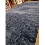 A substantial blue wool mix carpet in navy blue with silhouette pattern footprint overall 7.5 meters