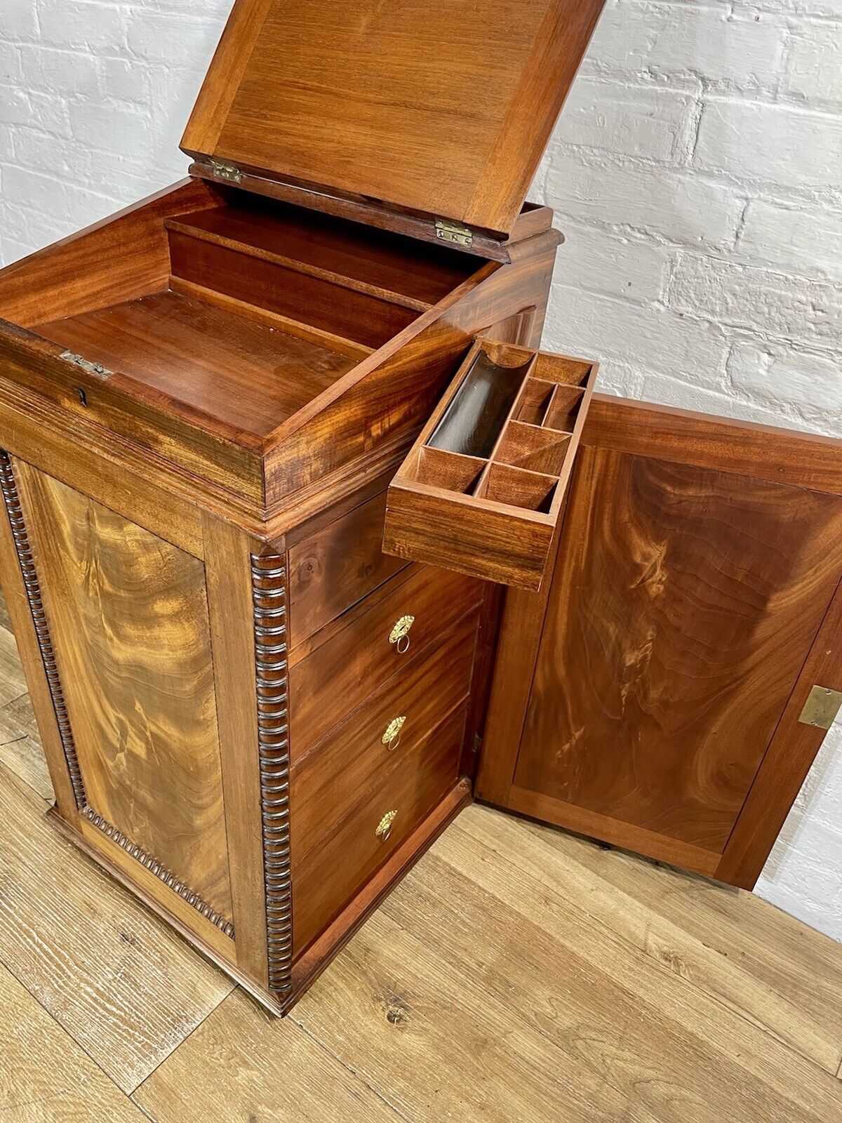 English Georgian Regency Flame Mahogany Davenport Writing Desk circa 1820 a moulded gallery above