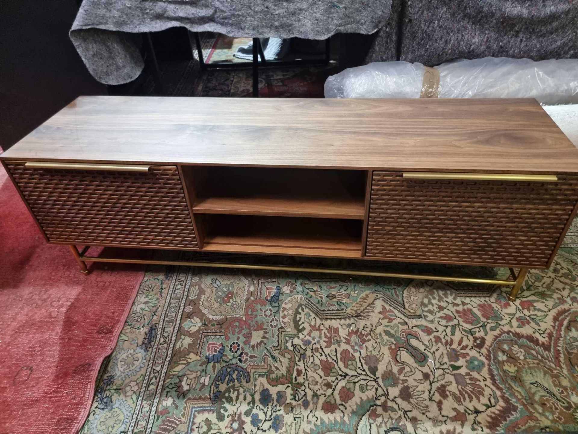 Combe Walnut Media Unit Solid And Veneer Black American Walnut With Honeycomb Carved Door Mounted on