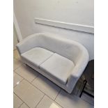 An upholstered grey neutral two seater curved back sofa on natural wood legs 145 x 70 x 72cm (Room