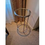 A stainless steel and tempered glass side table 35cm diameter x 64cm tall (Room 3A)