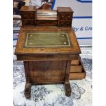 Inlaid Walnut Davenport 19th century The leather-lined hinged writing slope with a rear