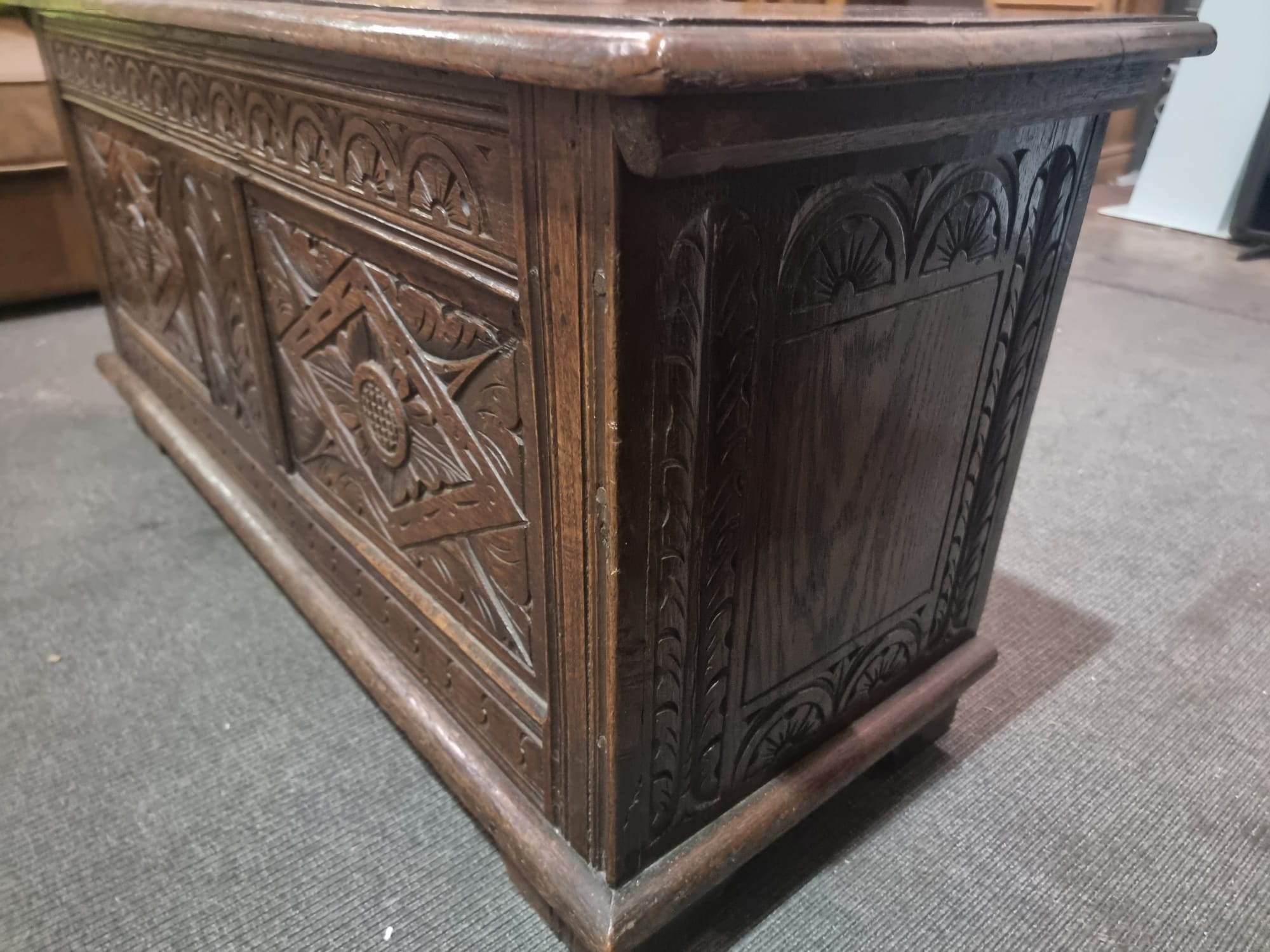 Late 18th Century style oak coffer the plank top above three geometrically carved panels on the - Image 13 of 17